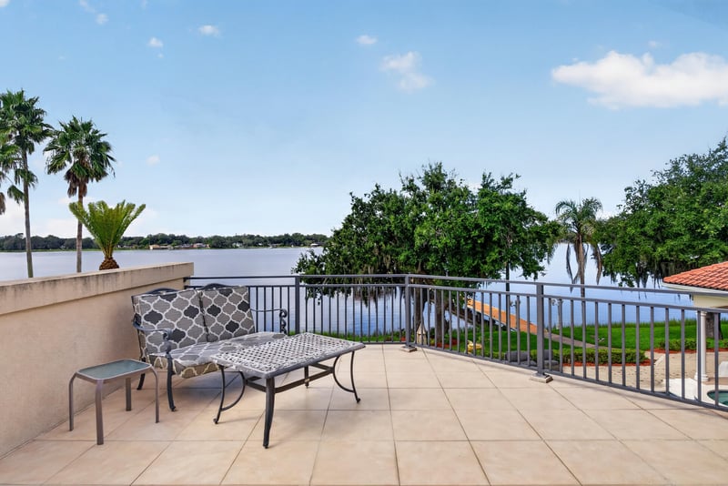 Balcony with patio furniture overlooking the lake at 344 Broward Rd, Jacksonville, FL