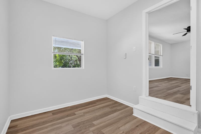 Bedroom with window and wood-look flooring at 855 Cornwallis Dr, Jacksonville, FL
