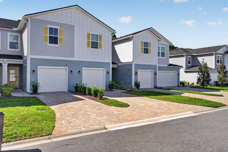 Front exterior, gray siding and yellow shutters at 39 Mellowood Ln, St. Augustine, FL 32092