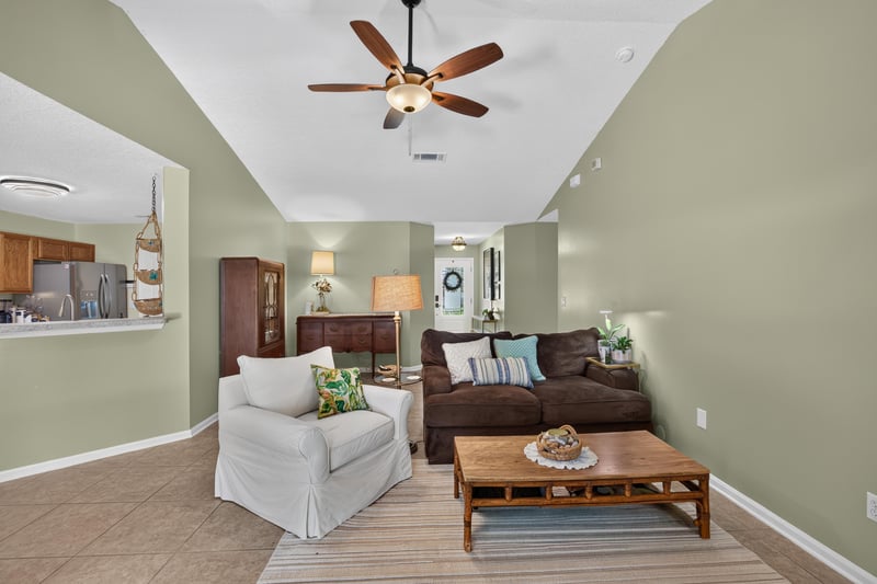 Living room with armchair and sofa at 1589 Backwater Drive, Middleburg, FL 32068
