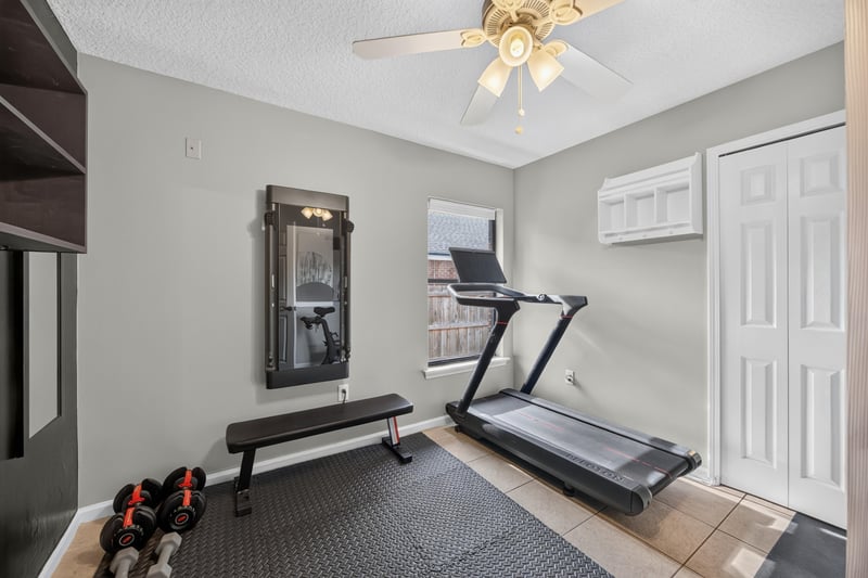 Home gym with treadmill and weight bench at 2125 Blue Heron Cove Dr, Orange Park, FL 32003