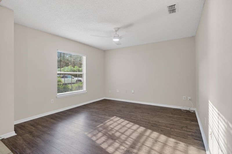 Empty room with wood flooring and natural light at 1648 Glen Laurel Dr, Middleburg, FL 32068
