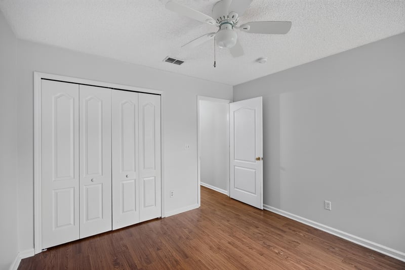 Bedroom with closet doors at 9691 Nelson Forks Dr, Jacksonville, FL 32222