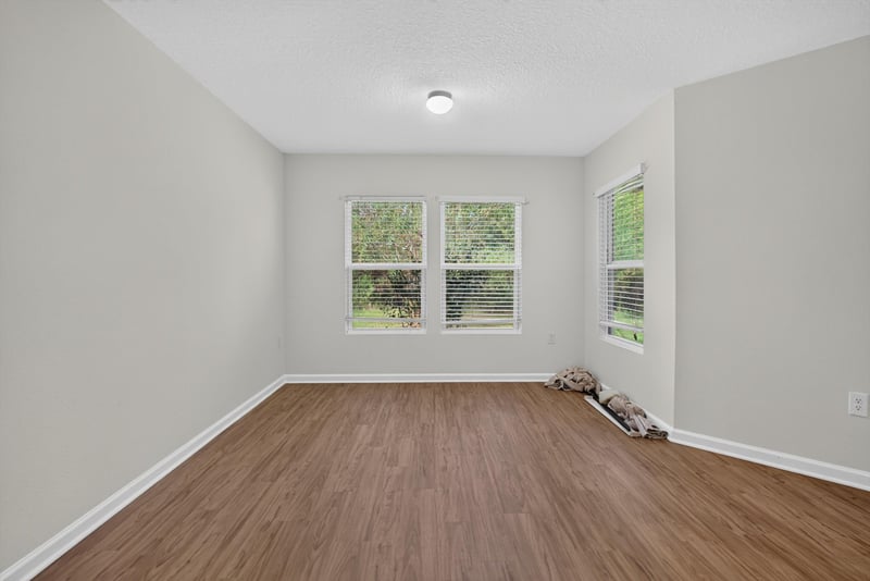 Bedroom with window and wood flooring at 95221 Siena Ct, Fernandina Beach, FL 32034