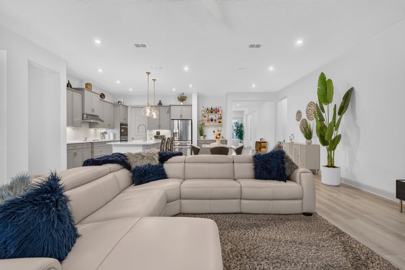 Living room with sectional sofa and area rug at 785 Back Creek Dr, St. Augustine, FL 32092