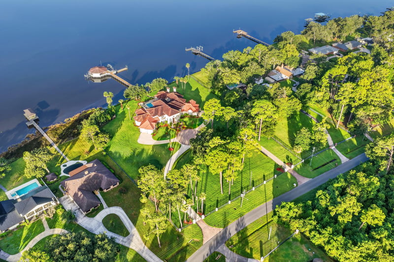Aerial view over tree canopy toward the water at 344 Broward Rd, Jacksonville, FL