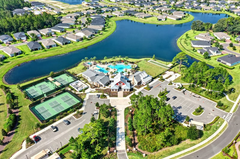 Aerial view of the community pond and clubhouse in St. Augustine, FL