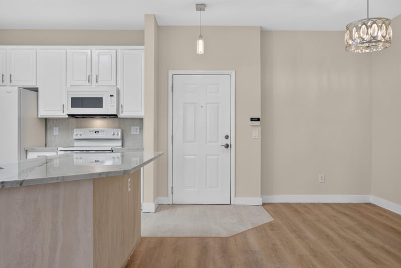 Kitchen with white cabinets and pendant lighting at 11251 Campfield Dr unit 1202, Jacksonville, FL 32256