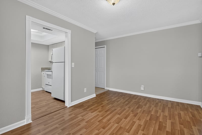 Room with view of refrigerator and wood floor at 3866 Campenero Ct unit 6, Jacksonville, FL 32217