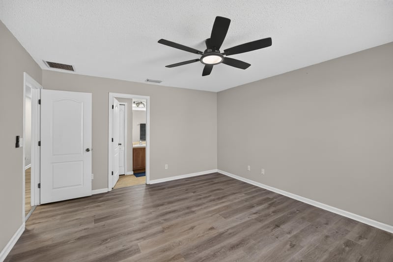 Empty bedroom with hallway doors visible at 7723 Playschool Ln, Jacksonville, FL