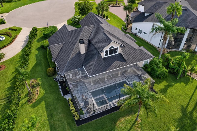 Aerial view of pool enclosure and roof at 2304 Spring Hill Ct, Orange Park, FL