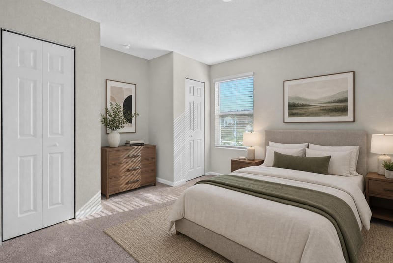 Second bedroom with staged bed and dresser at 4024 Bay Hawk Ct, Jacksonville, FL