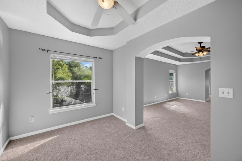 Bedroom with tray ceiling and wood beam at 470 Sparrow Branch Cir, Jacksonville, FL 32259