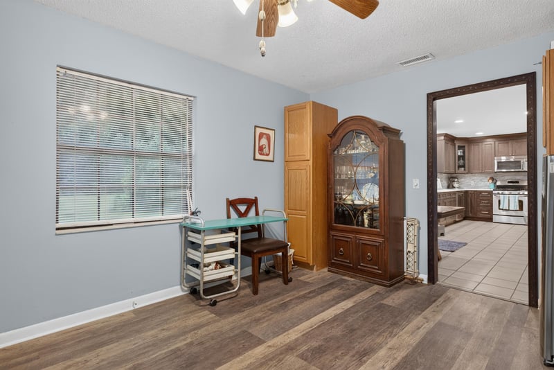 Flex room with china cabinet and kitchen view at 3249 Maryland Ave, Green Cove Springs, FL