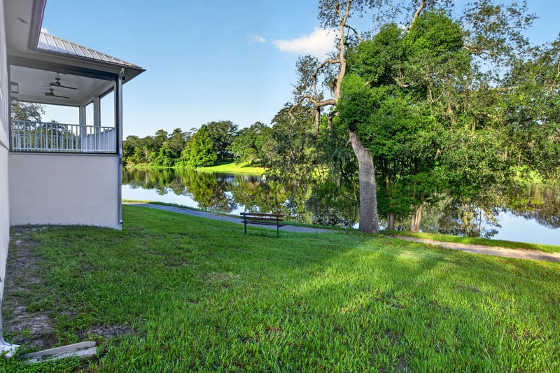 Drone view of backyard and pond at 175 Alava Ct