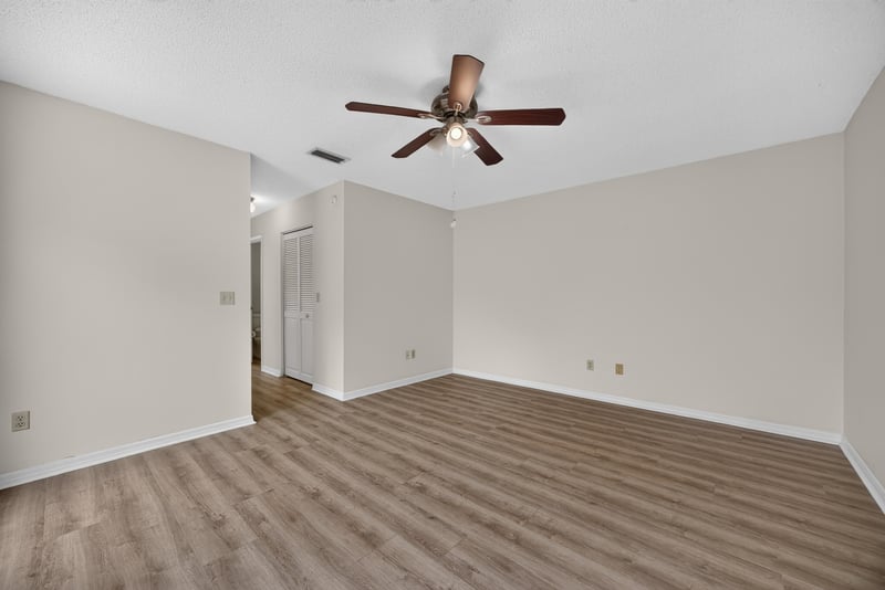 Empty room with ceiling fan and closet at 3407 Fairbanks Grant Rd N, Jacksonville, FL 32223