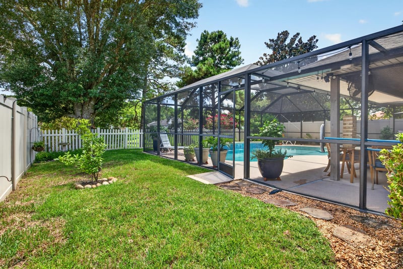 Backyard with screened pool and patio at 1589 Backwater Drive, Middleburg, FL 32068