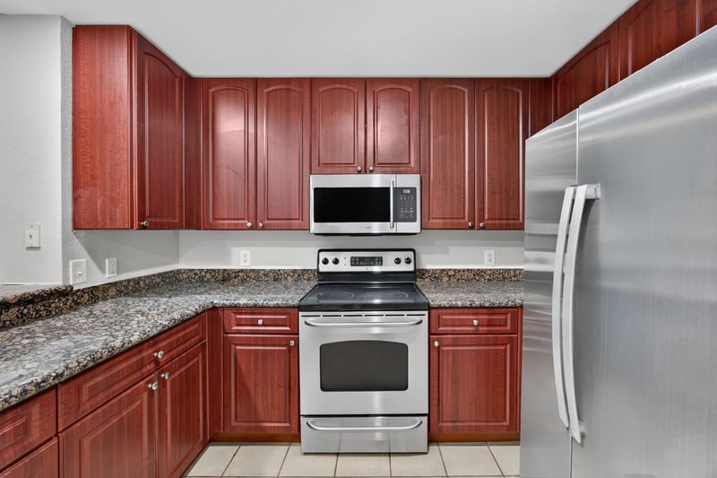 Kitchen with microwave and stainless refrigerator at 9745 Touchton Rd, Jacksonville, FL 32246