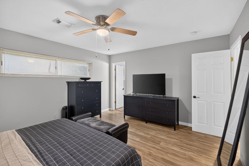 Bedroom with television and ceiling fan at 9506 Harriet Ave, Jacksonville, FL 32208