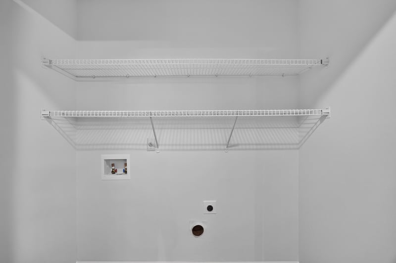 Laundry area with shelving and utility hookups at 551 Deltona Blvd, St. Augustine, FL 32086