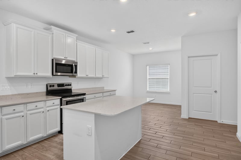 Kitchen with stainless range and microwave at 9905 Ansley Lake Dr, Jacksonville, FL