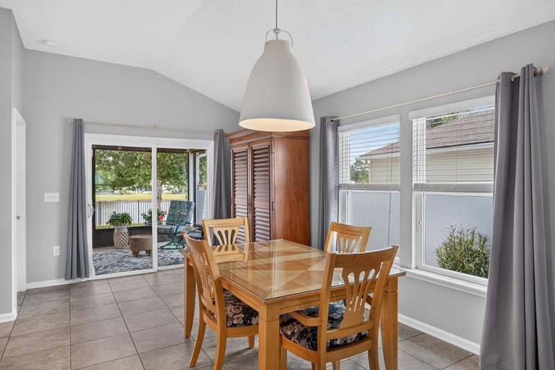 Dining area with sliding glass doors to patio at 85 Amia Dr, St. Augustine, FL 32086