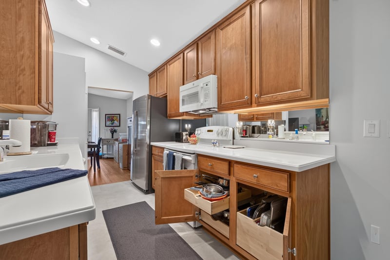 Kitchen with island and pull-out storage at 11225 Water Spring Cir, Jacksonville, FL 32256