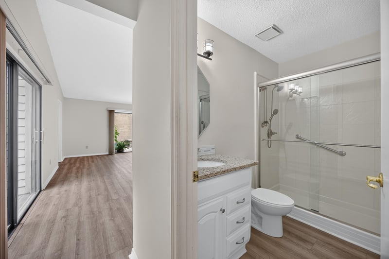 Hallway with bathroom and closet view at 3407 Fairbanks Grant Rd N, Jacksonville, FL 32223