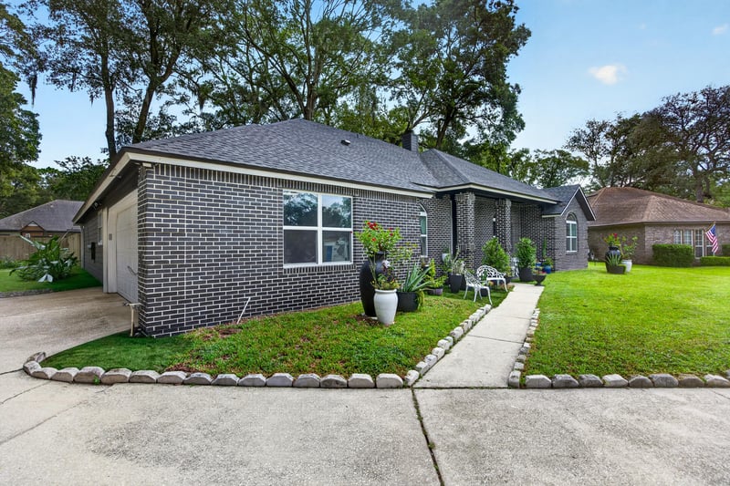 Front exterior with brick facade and landscaping at 1346 Gately Ct, Jacksonville, FL 32225