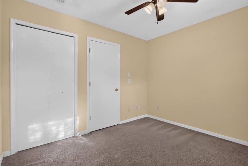 Bedroom closet area with ceiling fan at 353 Redwood Ln