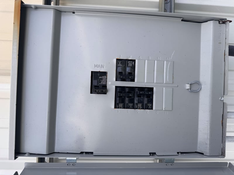 Open panel with main breaker labeled at 11700 New Kings Rd, Jacksonville, FL 32219