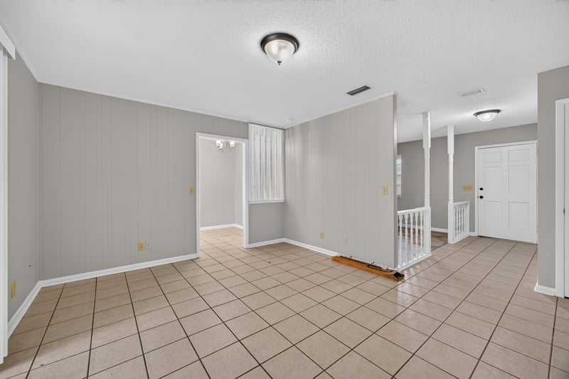 Room with tile flooring and multiple doorways at 12351 Condor Dr