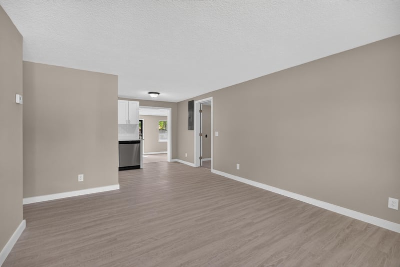 Empty room with hallway opening to kitchen at 184 Draco St, Orange Park, FL 32073