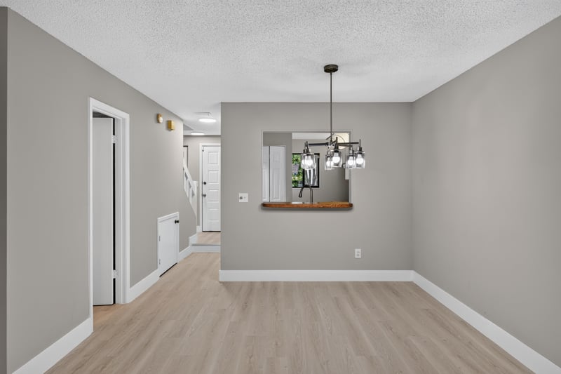 Dining area with pass-through to kitchen at 3801 Crown Point Rd, Jacksonville, FL 32257