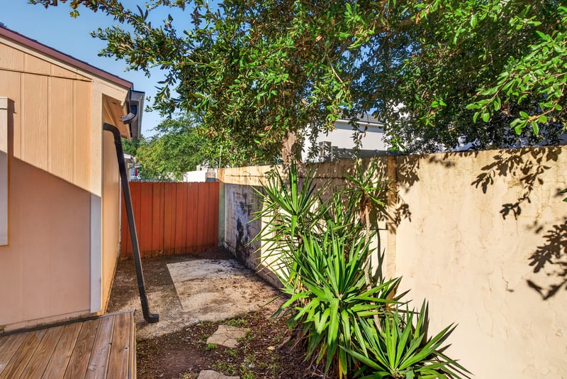 Backyard with wood fence and storage shed at 8177 Virgo St, Jacksonville, FL 32216