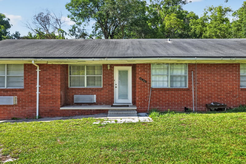 Close front view of porch and entry door at 5745 110th St, Jacksonville, FL 32244