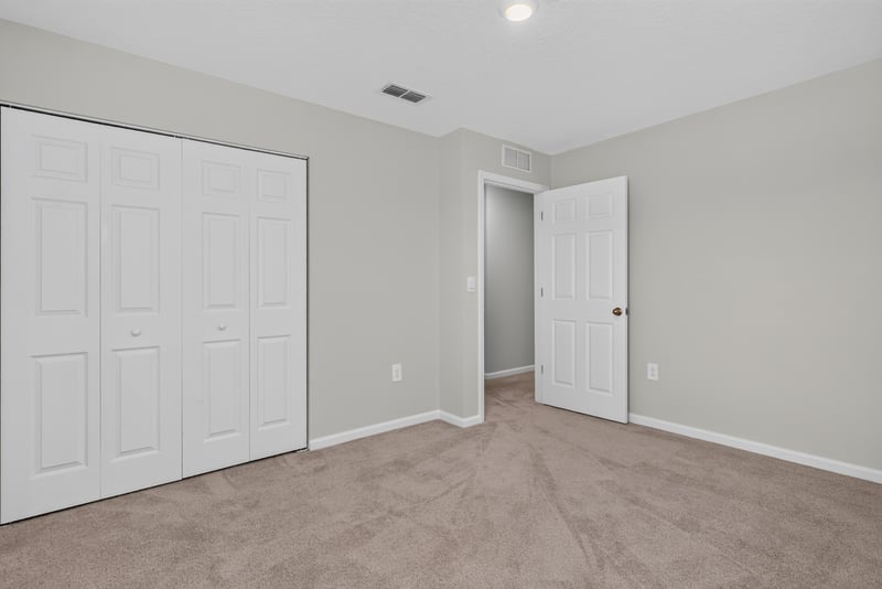 Third bedroom closet doors and hallway at 4024 Bay Hawk Ct, Jacksonville, FL