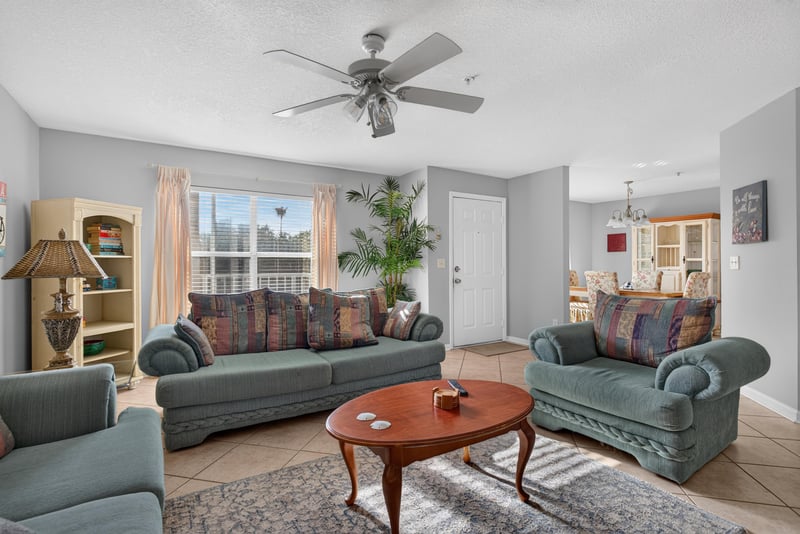 Living room sofa and loveseat around a wood coffee table at 206 16th St, St. Augustine, FL 32080