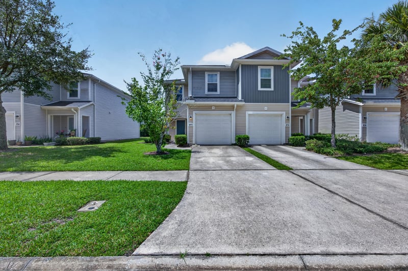 Street view of front exterior and driveway at 1572 Biscayne Bay Dr, Jacksonville, FL 32218