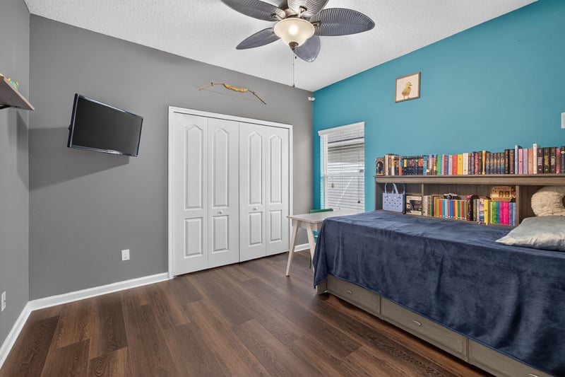 Bedroom with teal wall and desk at 538 Porta Rosa Circle, St. Augustine, FL 32092