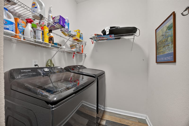 Laundry area with washer, dryer and shelving at 2065 Creekmont Dr