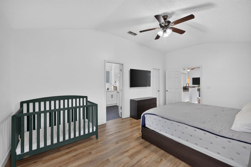 Bedroom with crib and bed at 8921 Needlepoint Pl, Jacksonville, FL 32244