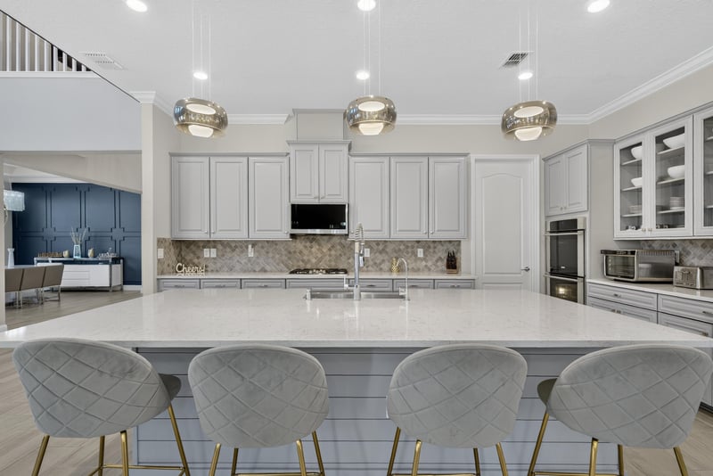 Kitchen island seating with pendant lights at 22 Azura Point