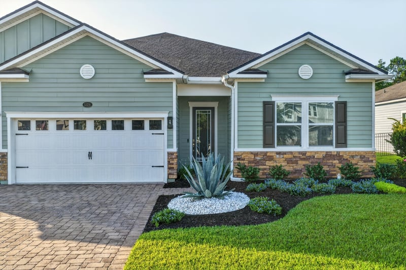 Front exterior close-up with landscaping and driveway at 3328 Southern Oaks Dr, Green Cove Springs, FL 32043