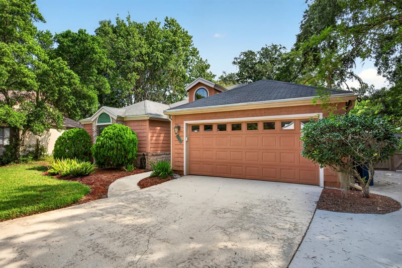 Front exterior closeup with brick facade at 4837 Pareja Ct, Jacksonville, FL 32225