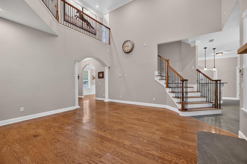 Entry with arched doorway and staircase at 1735 Hagans Ridge Ct