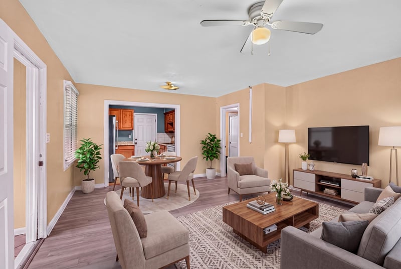 Living room with staged seating and dining area, wood-look floors at 2841 Ernest St, Jacksonville, FL 32205