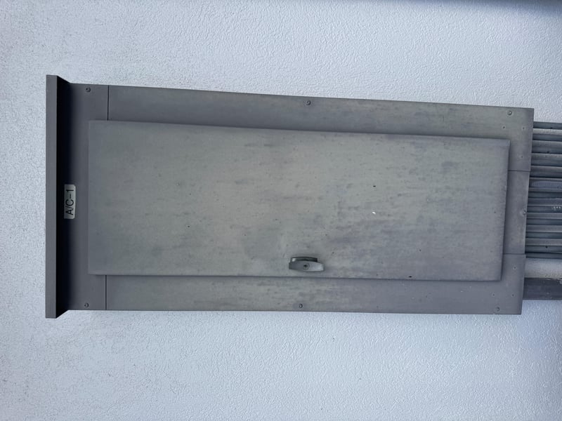 Metal mechanical access panel on exterior wall at 11700 New Kings Rd, Jacksonville, FL 32219