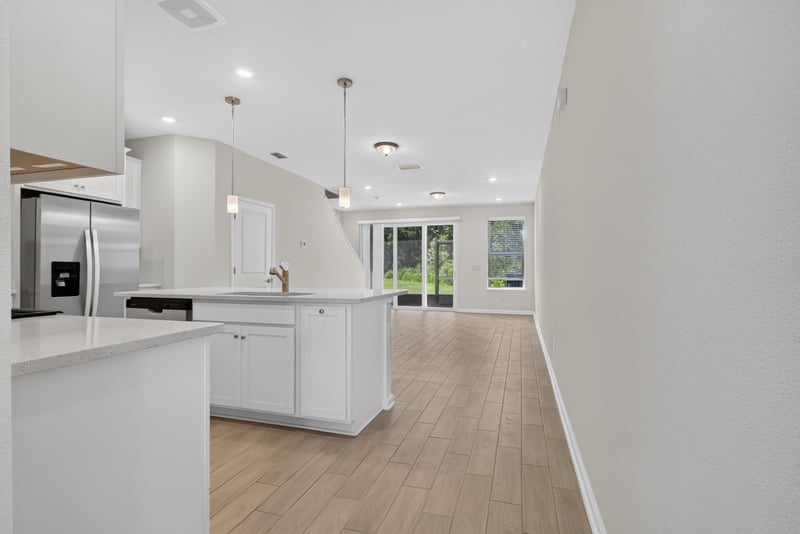 Kitchen view toward living room with wood floors at 39 Mellowood Ln, St. Augustine, FL 32092