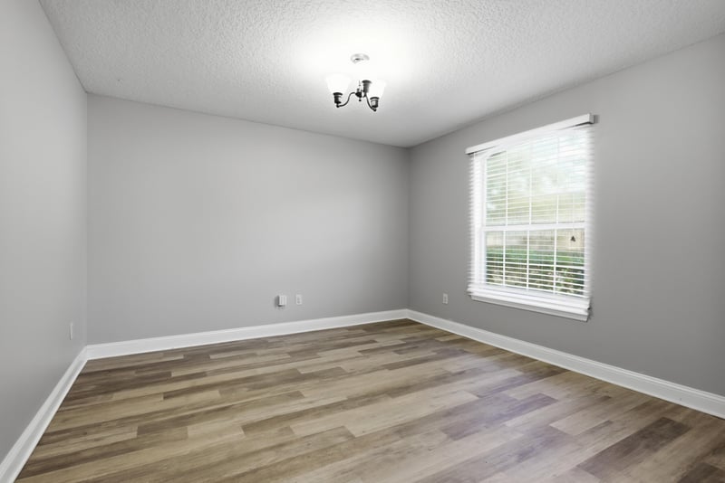 Bedroom with wood-look flooring and window at 14187 Big Spring St, Jacksonville, FL 32258